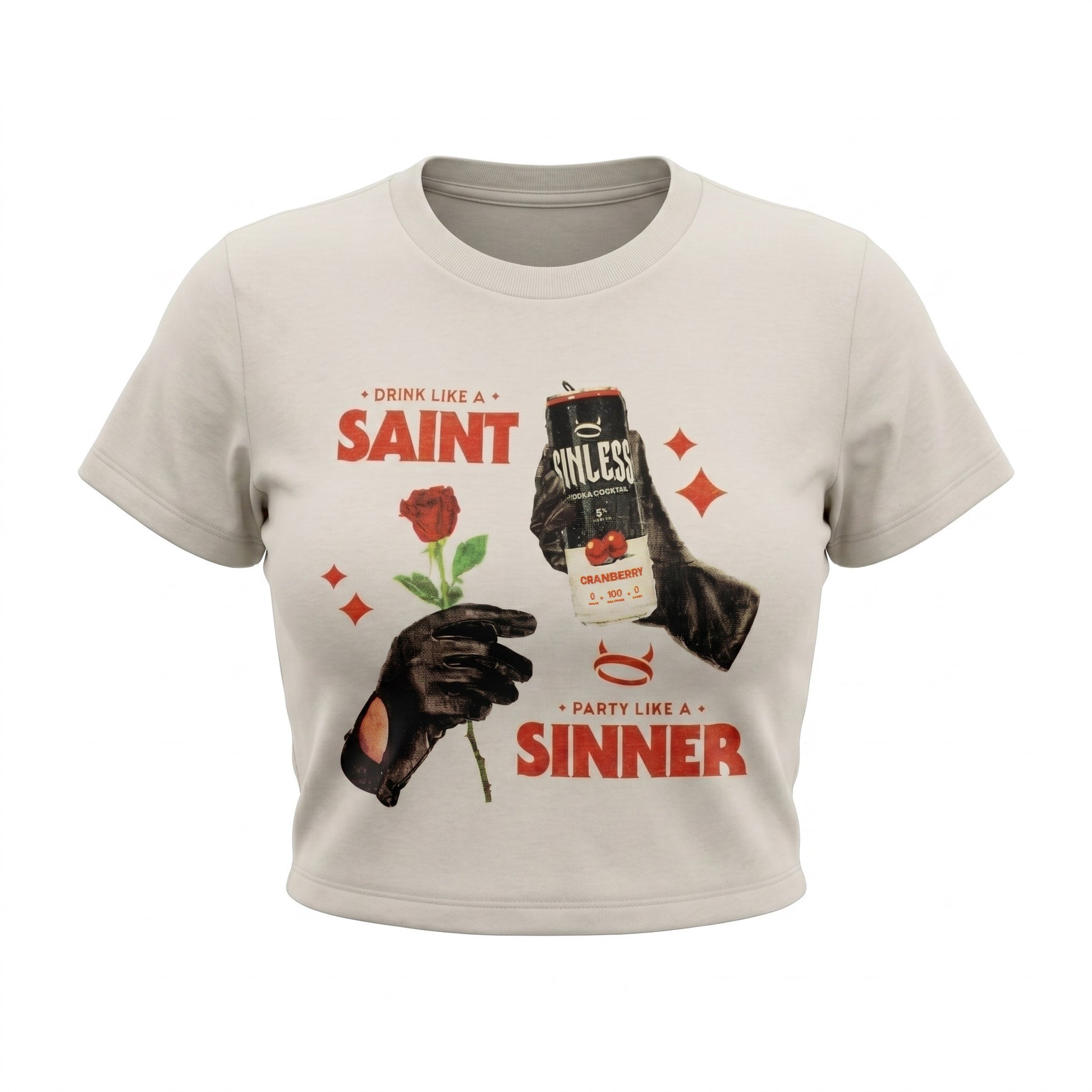 A light beige cropped t-shirt featuring a graphic print with the text 'SAINT' and 'SINNER' in red, a black-and-white beer can, a red rose, and black gloves.