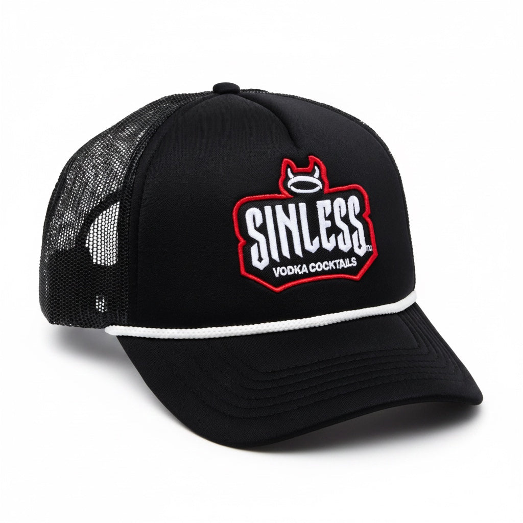 A side view of a black trucker hat against a white background. The Sinless logo is written in white across the front of the hat. Vodka cocktails is written under the logo in white. The logo is outlined in red. There is a halo with devil horns at the top of the logo. There is a side view of then back of the hat which is mesh. 