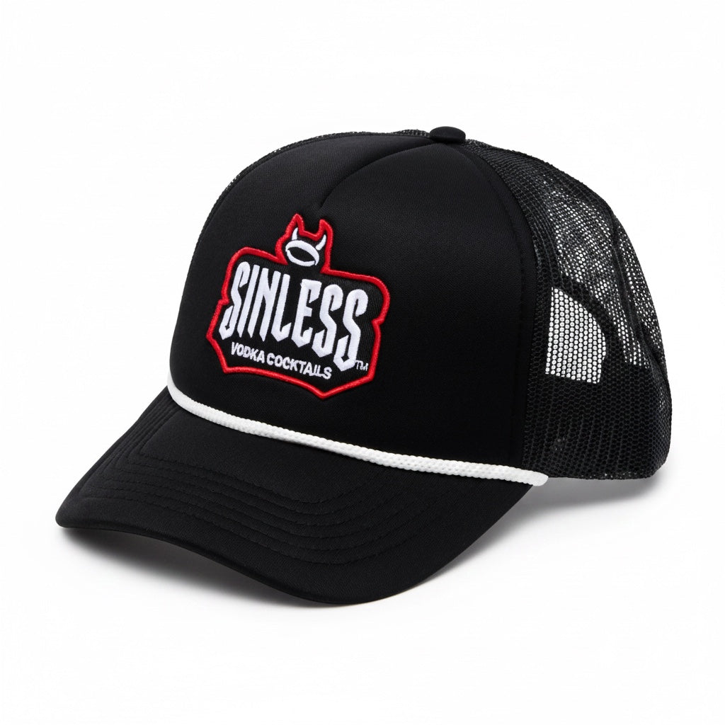 A side view of a black trucker hat against a white background. The Sinless logo is written in white across the front of the hat. Vodka cocktails is written under the logo in white. The logo is outlined in red. There is a halo with devil horns at the top of the logo. There is a side view of then back of the hat which is mesh. 
